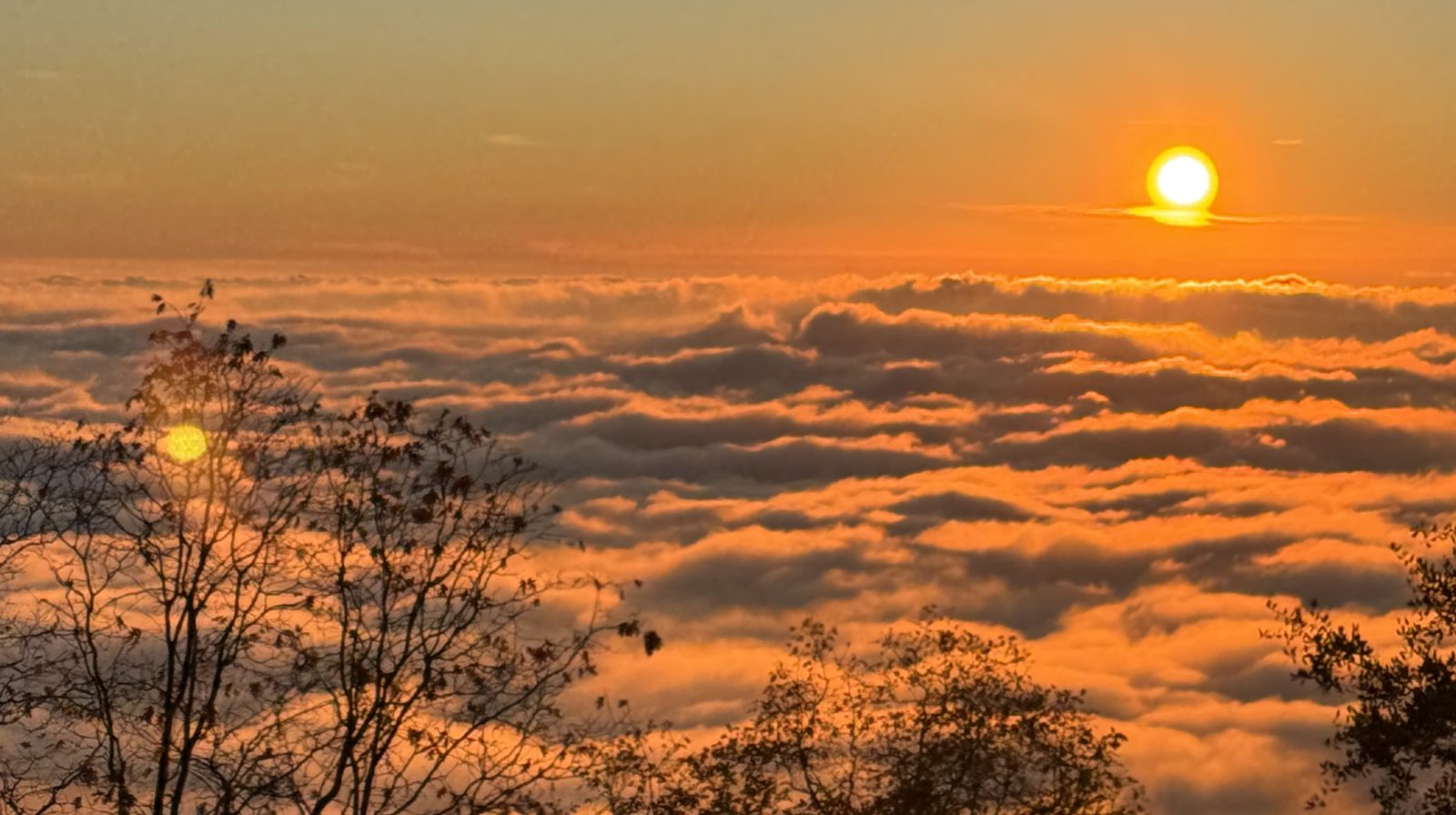 Sunrise over a sea of clouds seen from the mountain property where THE CAMPUS will be built
